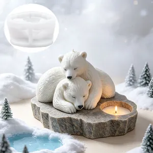 Detailed view of polar bear cuddling silicone mold and finished winter candle holder