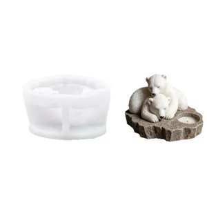Silicone mold for DIY polar bear candle holder featuring two cuddling bears on a rock