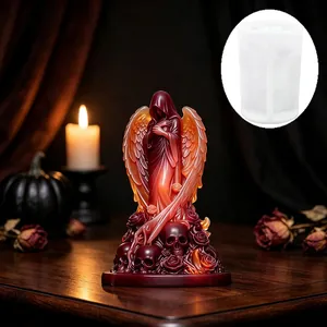 Detailed view of the gothic angel candle mold with a finished red resin sculpture