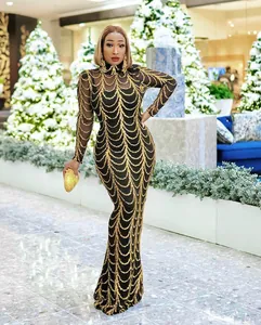 Elegantes langärmliges Meerjungfrauen-Abendkleid mit goldenem Pailletten-Wellenmuster