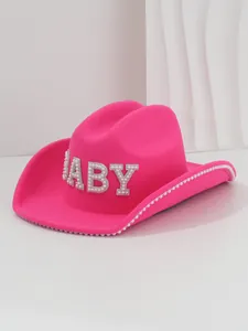 Detail of pink wool cowboy hat featuring rhinestone BABY letters and pearl brim trim