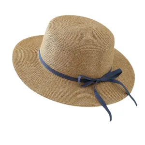 Elegant raffia straw sun hat with wide brim and blue ribbon bow decoration