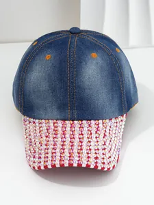 Close-up detail of women's denim baseball cap featuring heavy sparkling rhinestones