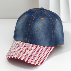 Denim baseball cap with heavy rhinestones and red-white striped brim details