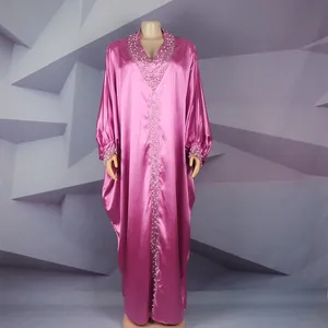 Detail view of the satin African BUBU robe with rhinestone and bead embellishments.