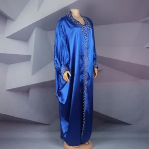 Detail view of royal blue African Bubu robe with exquisite rhinestone and beadwork.
