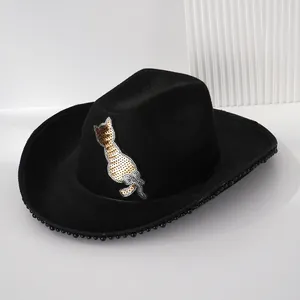 Close-up of women's black Western cowboy hat featuring a sequined cat motif and pearl brim detail