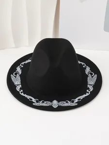 Detail view of the intricate cicada embroidery on the brim of a black retro fedora hat