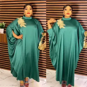 Emerald green African rayon kaftan with stand collar and gold floral appliqué detail