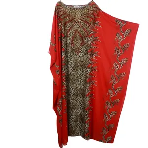 Detail of red African kaftan dress with leopard print and sparkling rhinestone neckline