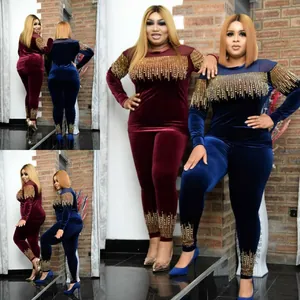 Two-piece African women's velvet set featuring elegant gold rhinestone fringe detailing