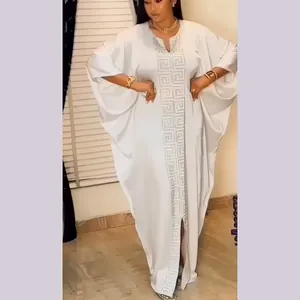 Elegant white African plus-size kaftan dress with shimmering geometric Greek key pattern