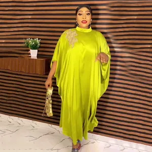 Elegant lime green African kaftan dress with gold rhinestone flower applique detail