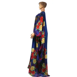 Detail of an African floral chiffon kaftan with elegant gold rhinestone accents.