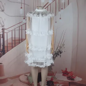 Elegant white sleeveless petal ruffled princess puff dress for dance performance on mannequin