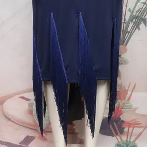 Detailed close-up view of the navy blue dress hem featuring long stylish fringes