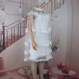 Side view detail of elegant white tulle dress with layered petal ruffles for dance