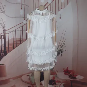 Detailed view of white ruffled tulle princess dress for dance performances gala.