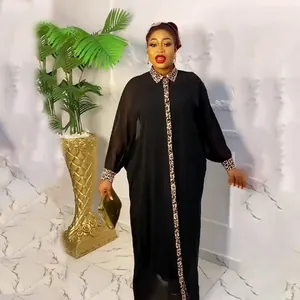 Elegant black loose-fitting robe with leopard print details and rhinestone accents