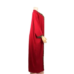 Side view of red African style long dress with elegant gold lace embroidery details.