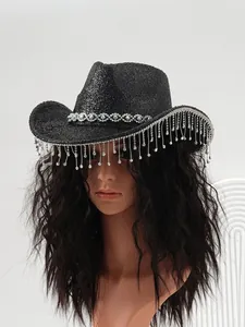 Close-up of black cowboy hat with rhinestone tassels on a mannequin head