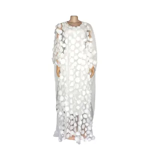 Detailed view of white African long dress featuring intricate 3D petal embroidery