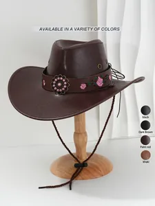 Detailansicht eines braunen PU-Leder-Cowboyhuts mit Blumenstickerei und Perlenzubehör.