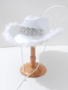 Elegant white cowboy bride hat with rhinestone lettering and soft feather trim detail