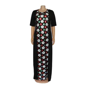 Detailed view of plus size African maxi dress with colorful floral sequin embroidery.