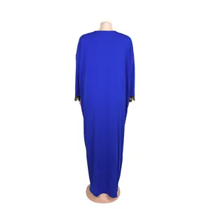 Back view of a royal blue African style long dress with elegant lace cuffs and large swing.