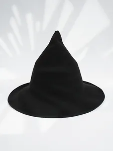 Close-up view of a black knitted pointed witch hat with wide brim for Halloween.