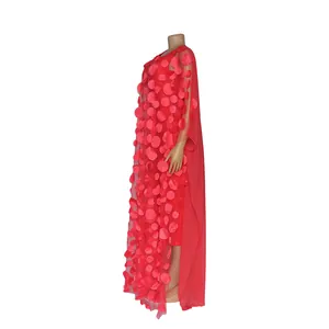 Side view of a red African maxi dress with 3D floral embroidery on a display mannequin.