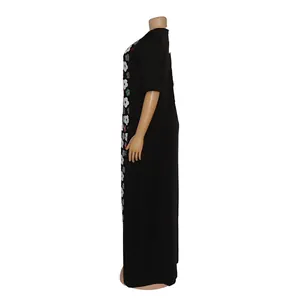 Side view of black African plus size maxi dress with floral embroidery and sequins