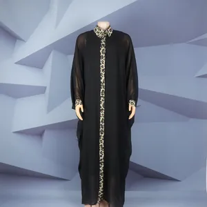 Full-length view of a black evening robe with leopard print and rhinestone detailings