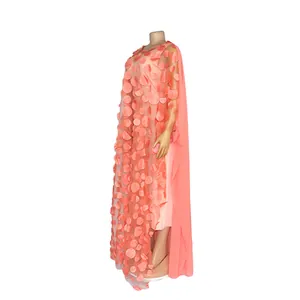 Detailed side view of peach African kaftan dress with 3D floral petal appliques.