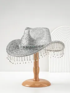 Detail of silver glitter cowboy hat with long sparkling rhinestone fringe on a stand