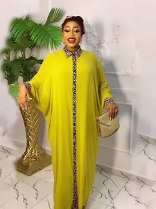 Elegant yellow loose kaftan dress with leopard print collar and cuffs for evening wear.