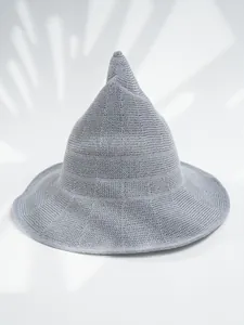 Detailed view of a gray knitted pointed witch hat with textured woven fabric finish.