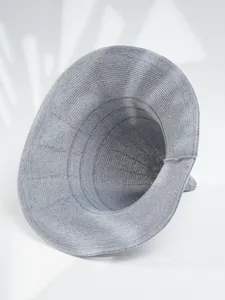 Detail showing the high-quality grey knitted fabric of a minimalist pointy witch hat.
