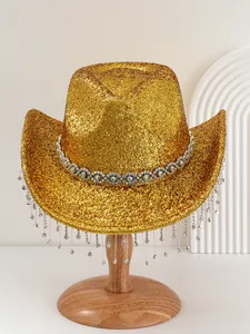 Detail view of golden glitter cowboy hat with rhinestone fringe tassels for party stage wear.