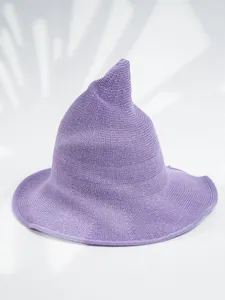 Detailed view of the knit texture on a purple pointed witch hat for Halloween costumes.