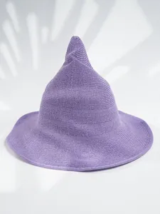 Detailed macro view of a purple knitted pointed witch hat for Halloween cosplay party