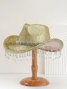 Detailed view of glamorous golden glitter cowboy hat with heavy rhinestone tassel fringe