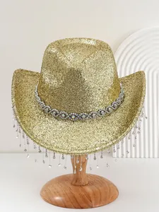 Detailed close-up of a gold glitter cowboy hat featuring rhinestone trim and long fringes