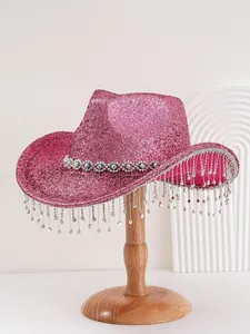 Pink glitter cowboy hat with luxury rhinestone fringe tassels on wooden display stand