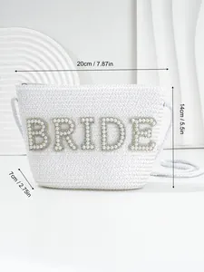Macro view of white bridal straw clutch with pearl lettering and size measurements