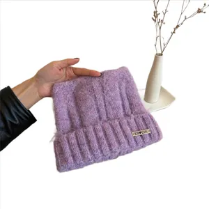 Cozy purple cat ear knit beanie for women, warm winter crochet hat with metal logo detail
