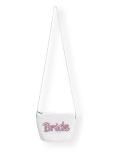 Close-up detail of a white woven crossbody bag with pink pearl Bride lettering