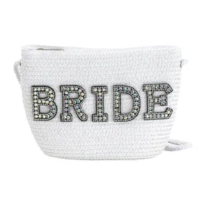 Elegant white woven bride crossbody bag with sparkling rhinestone 'BRIDE' lettering detail
