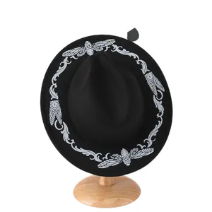 Vintage black fedora hat featuring white cicada and scroll embroidery on wide brim